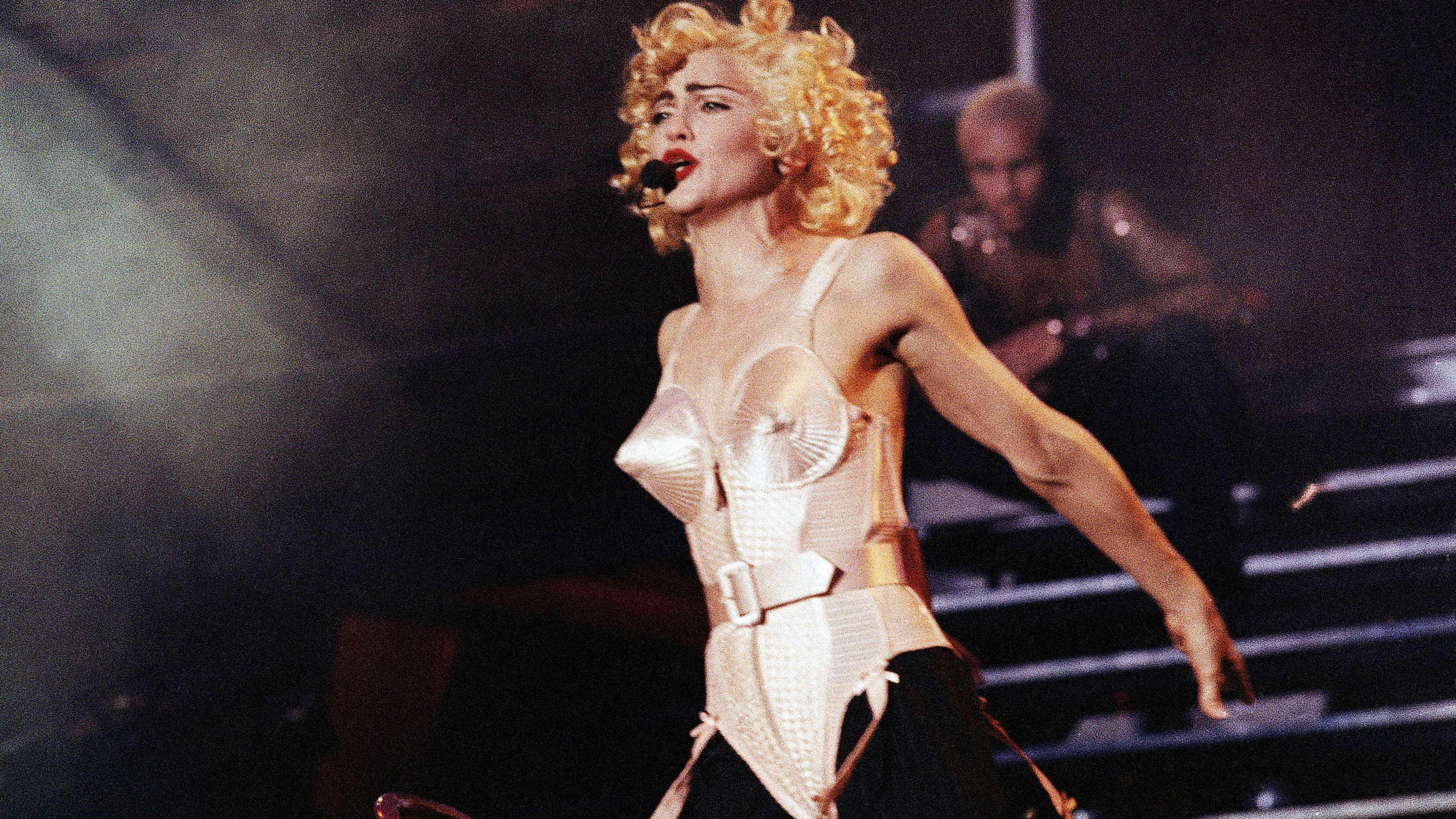 Pop star Madonna goes into a frenzy before a full Vicente Calderon Stadium in Madrid on July 27, 1990 during the first of three performances in Spain. (AP Photo/Jimmy Rubio)