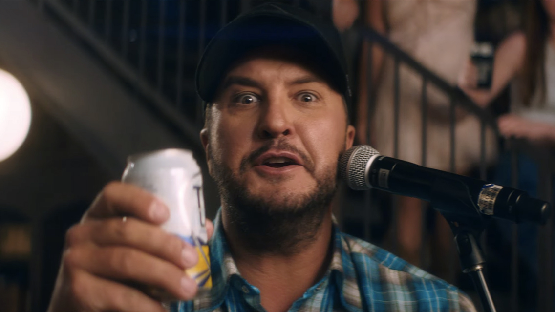 Luke Bryan But I Got A Beer In My Hand