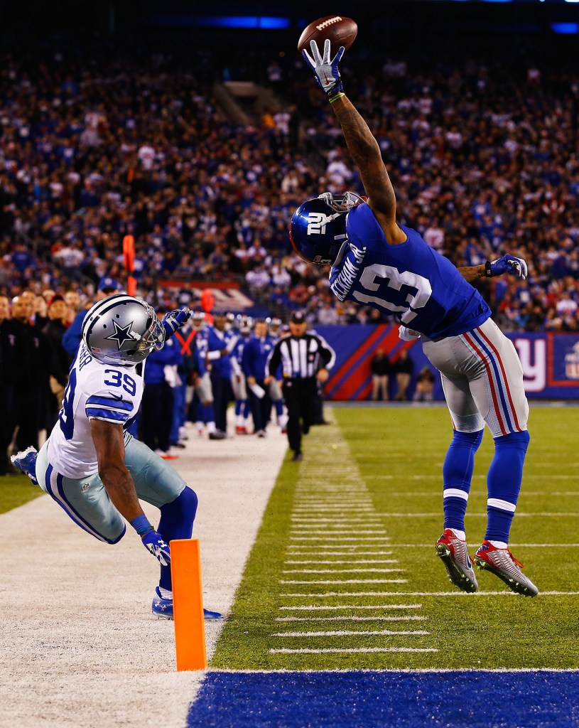 EAST RUTHERFORD, NJ - NOVEMBER 23: Odell Beckham #13 of the New York Giants scores a touchdown in the second quarter against Brandon Carr #39 of the Dallas Cowboys at MetLife Stadium on November 23, 2014 in East Rutherford, New Jersey. (Photo by Al Bello/Getty Images)