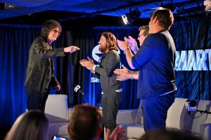 Howard Stern joining the SmartLess hosts onstage in the Hamptons.