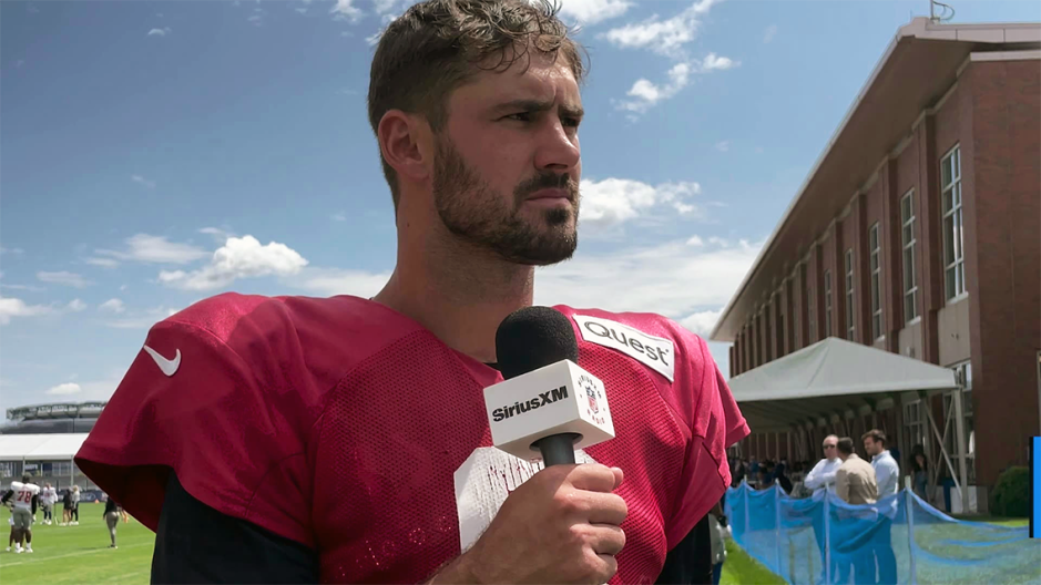 Daniel Jones talking to SiriusXM NFL Radio at training camp.