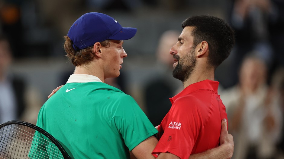Jannik Sinner L and Novak Djokovic hug each other after the men's singles semifinal match between Jannik Sinner of Italy and Novak Djokovic of Serbia at the French Open tennis tournament at Roland Garros, Paris, France, June 6, 2025. (Photo by Li Jing/Xinhua via Getty Images)