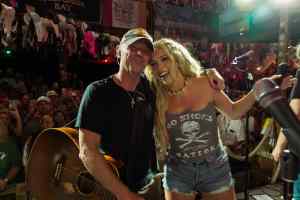 Photo of Kenny Chesney and Megan Moroney performing live at Flora-Bama for SiriusXM.